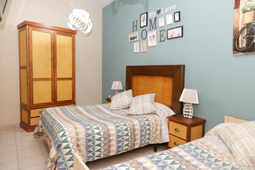 Cama o camas de una habitación en Pension Internacional