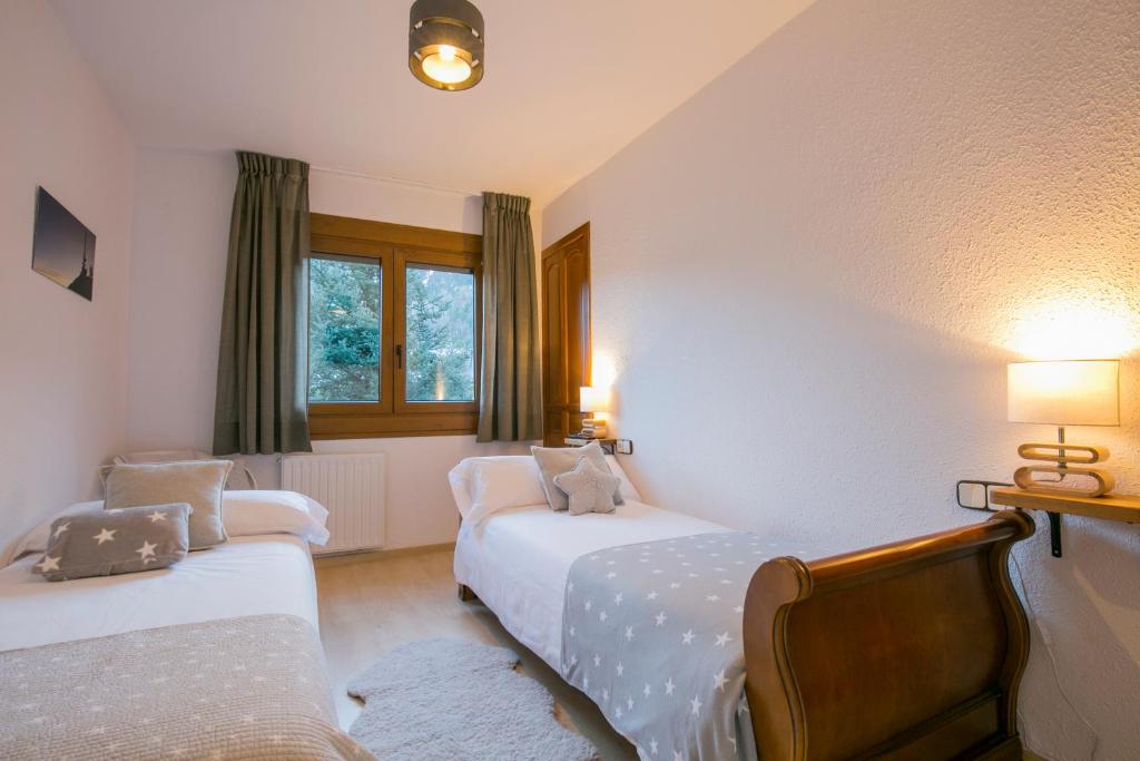 Postel nebo postele na pokoji v ubytování B&B La Lluna