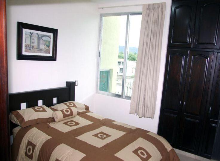 Postel nebo postele na pokoji v ubytování MR Hotel