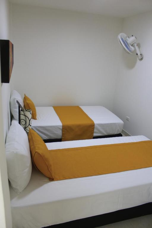 Postel nebo postele na pokoji v ubytování Hotel Pereira 421