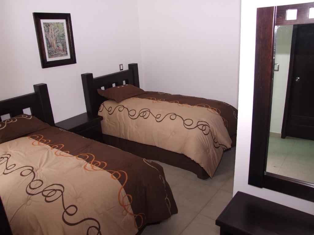 Postel nebo postele na pokoji v ubytování MR Hotel