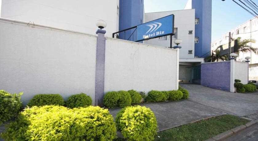 a building with bushes in front of a building at Hotel Biz in Sao Paulo