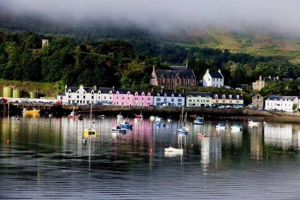 a town with boats in a body of water at Harbour View in Portree
