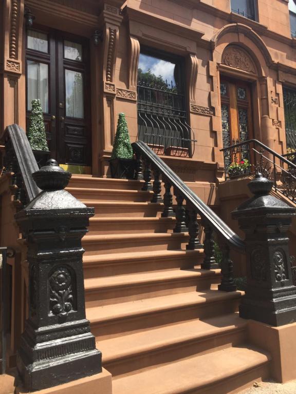 a set of stairs in front of a house at Harlem Grand in New York