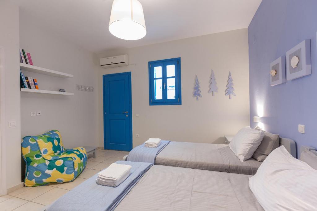 Posteľ alebo postele v izbe v ubytovaní JUST BLUE with amazing Sea Views in Piso Livadi