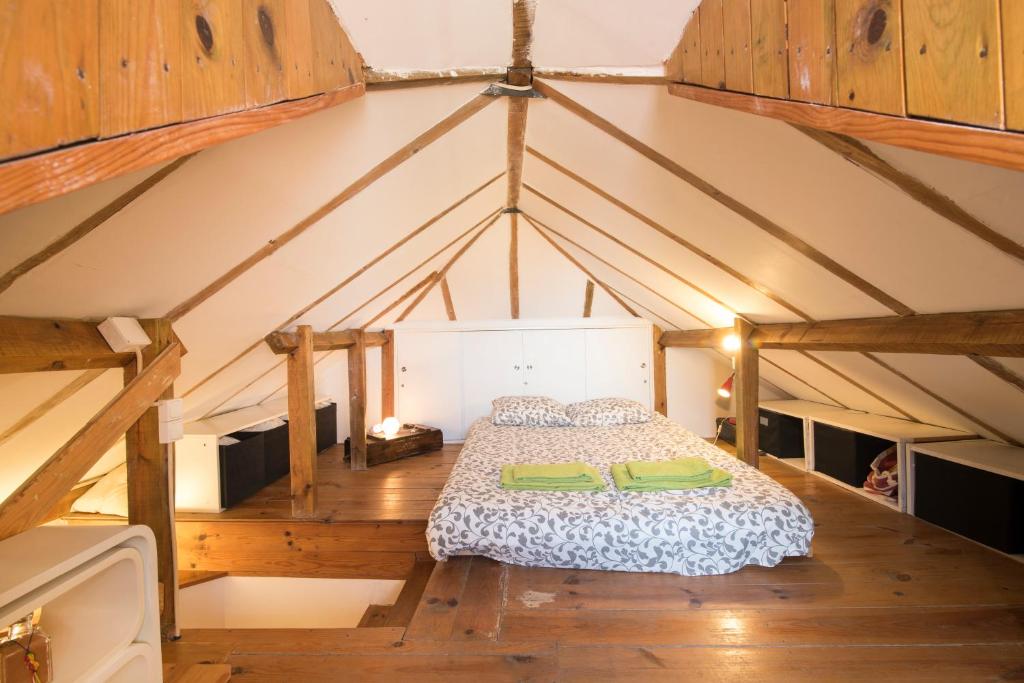 a bedroom with a bed in the attic at Alfama Apartment in Lisbon