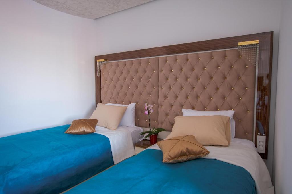 Postel nebo postele na pokoji v ubytování New Hotel
