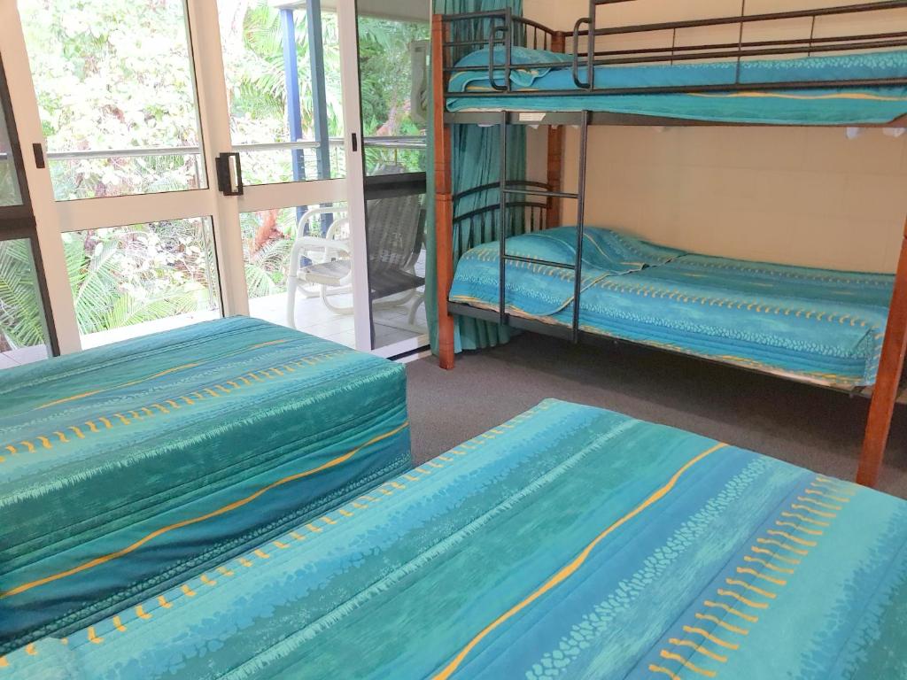 Postel nebo postele na pokoji v ubytování Mango Tree Holiday Apartments