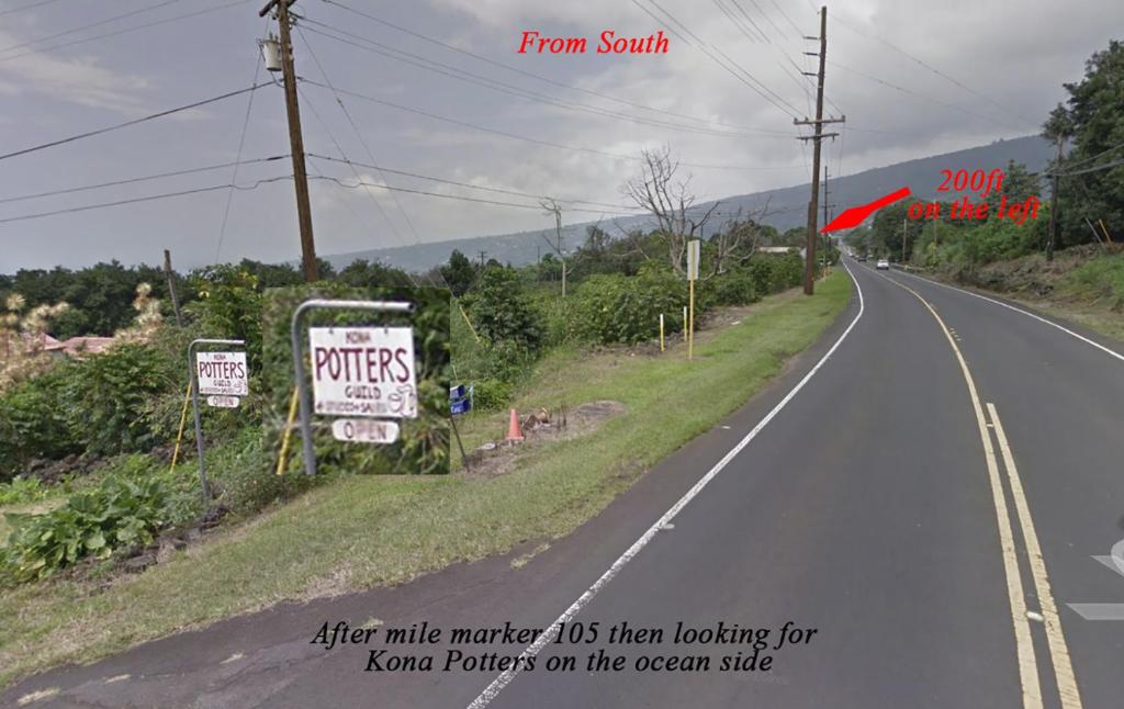 an empty road with a sign on the side at Coffee Garden in Captain Cook