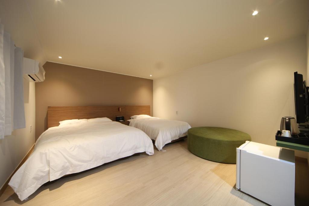 Soho Hotel tesisinde bir odada yatak veya yataklar