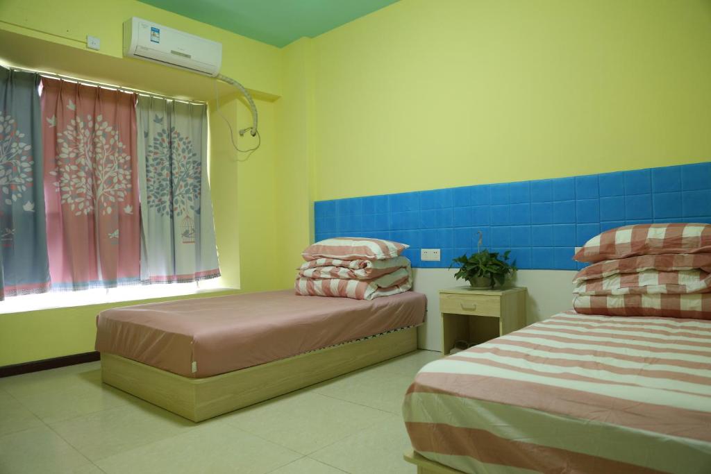 Postel nebo postele na pokoji v ubytování Wuhan Worry-free Capsule Hotel