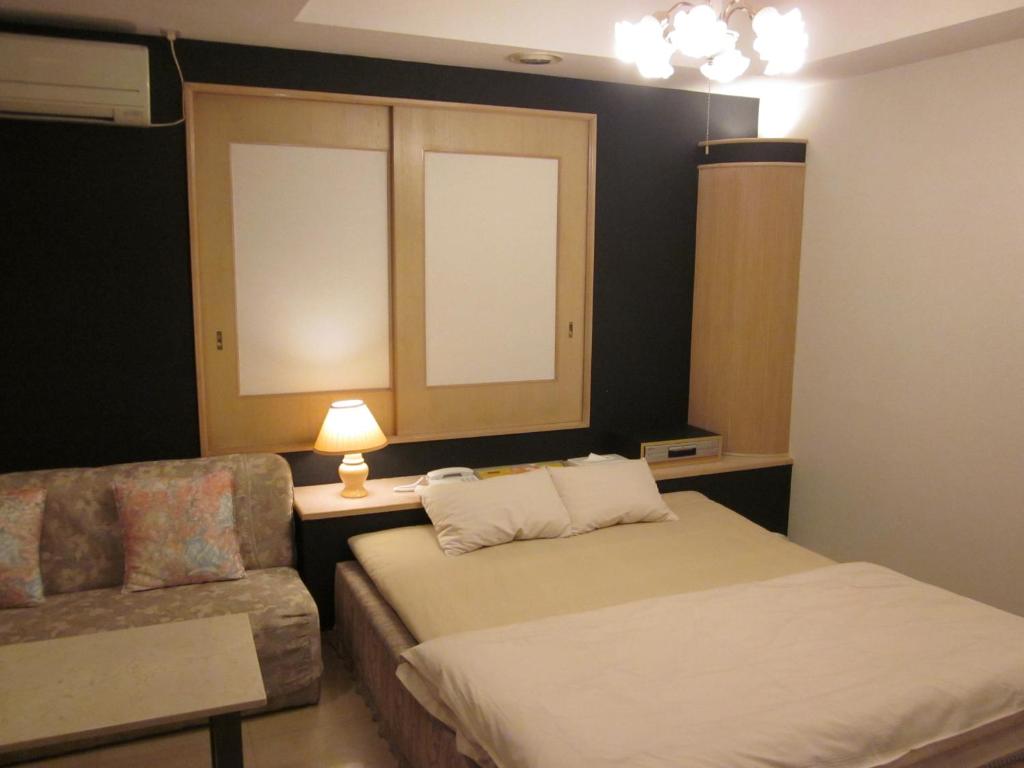 Postel nebo postele na pokoji v ubytování Hotel Essor (Adult Only)