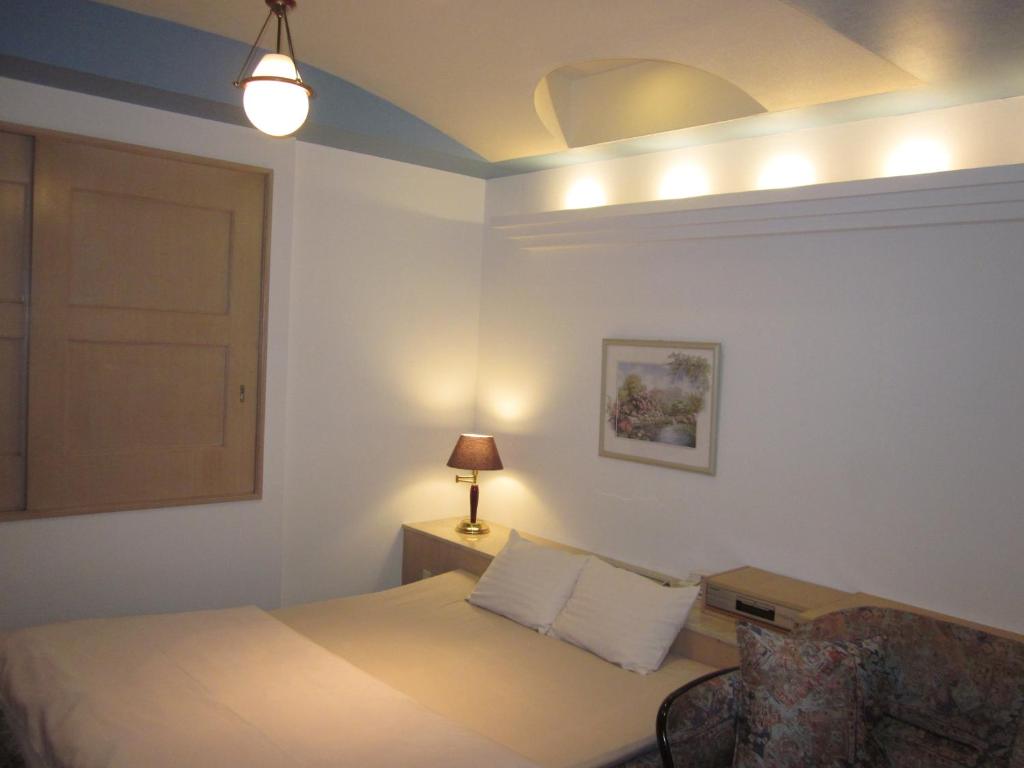 Postel nebo postele na pokoji v ubytování Hotel Essor (Adult Only)