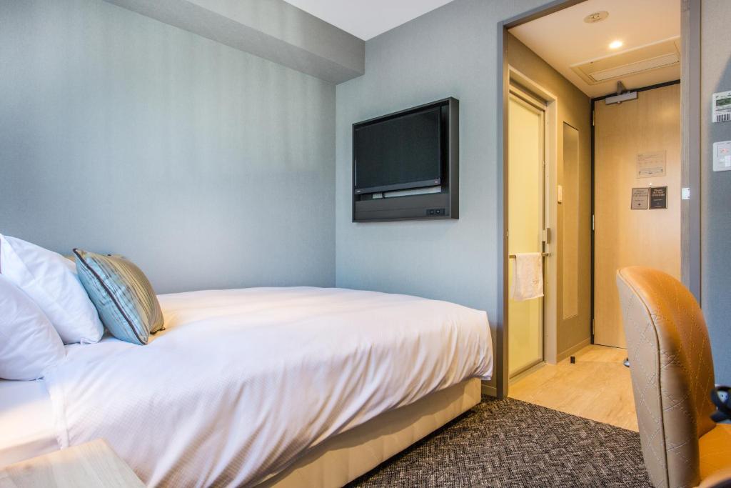 Cama ou camas em um quarto em Hotel Musse Ginza Meitetsu