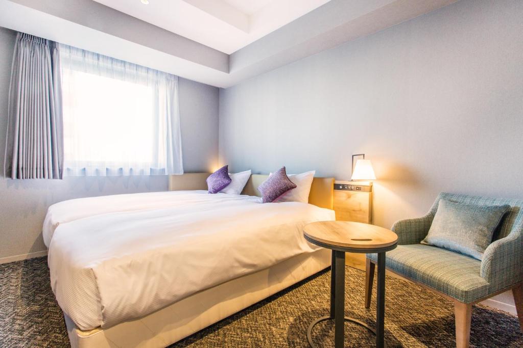 Cama ou camas em um quarto em Hotel Musse Ginza Meitetsu