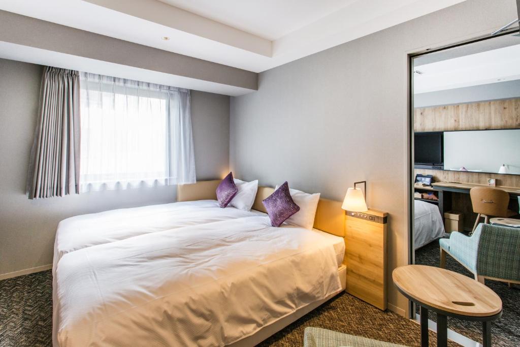 Cama ou camas em um quarto em Hotel Musse Ginza Meitetsu