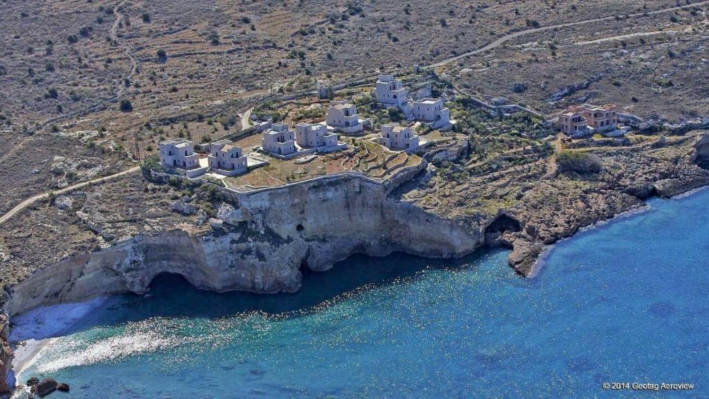 an aerial view of a house on a cliff next to the water at Mezapos Villa Katerina in Mézapos