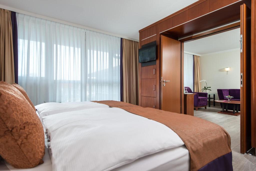 Postel nebo postele na pokoji v ubytování Radisson Blu Park Hotel & Conference Centre