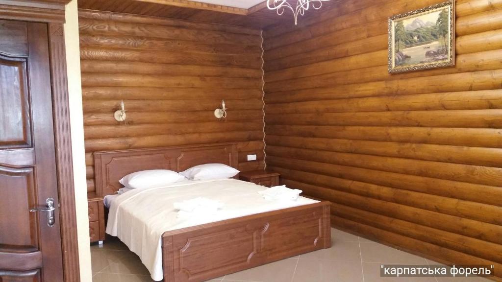 Postel nebo postele na pokoji v ubytování Karpatska Forel