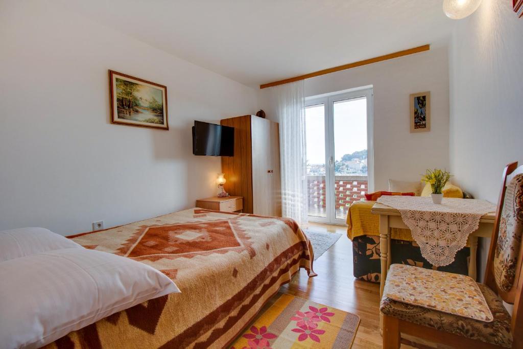 Postel nebo postele na pokoji v ubytování Apartman Dragica