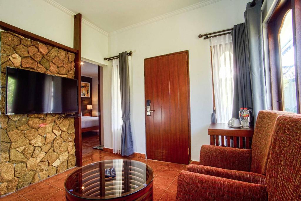 TV a/nebo společenská místnost v ubytování Brits Resort Lovina