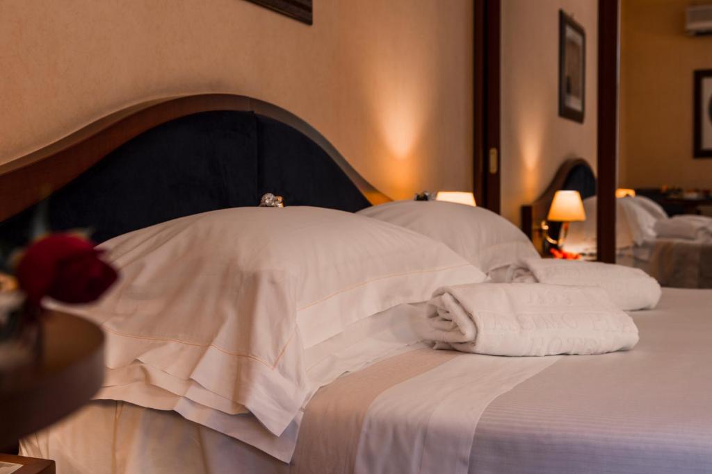Posteľ alebo postele v izbe v ubytovaní Massimo Plaza Hotel