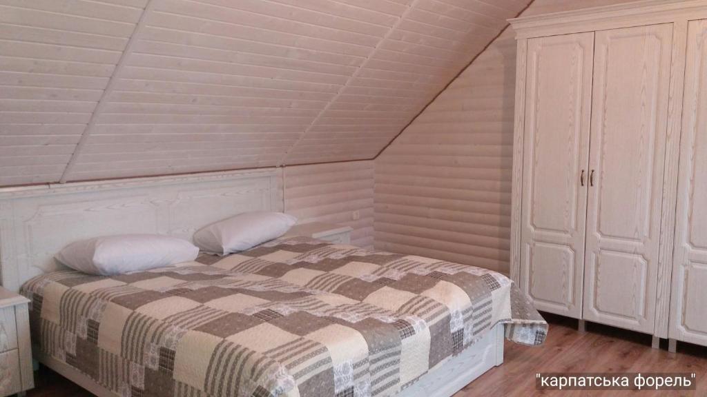 Postel nebo postele na pokoji v ubytování Karpatska Forel