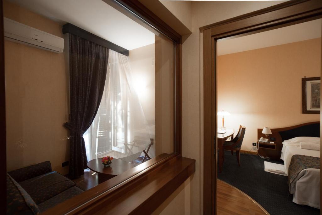 Posteľ alebo postele v izbe v ubytovaní Massimo Plaza Hotel