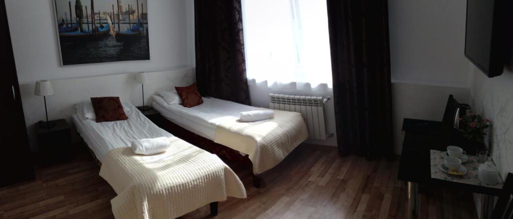 Postel nebo postele na pokoji v ubytování Gościniec Margo