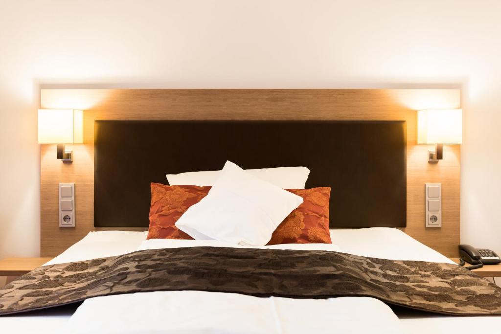 Postel nebo postele na pokoji v ubytování Hotel Weisses Ross