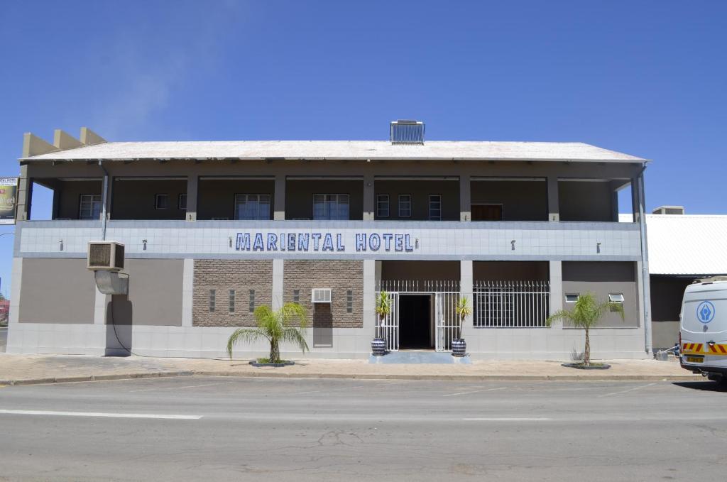 a building on the corner of a street at Mariental Hotel Cc in Mariental