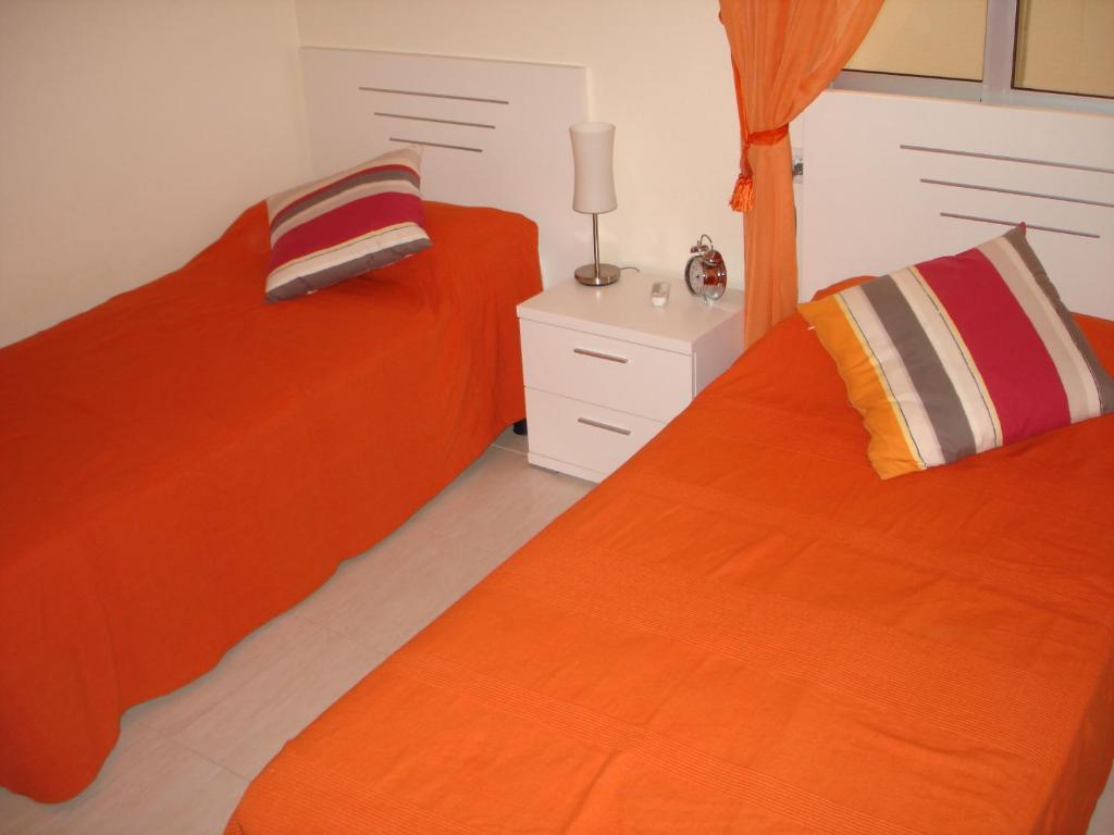 Postel nebo postele na pokoji v ubytování Reception La Rotonda Aparthotel