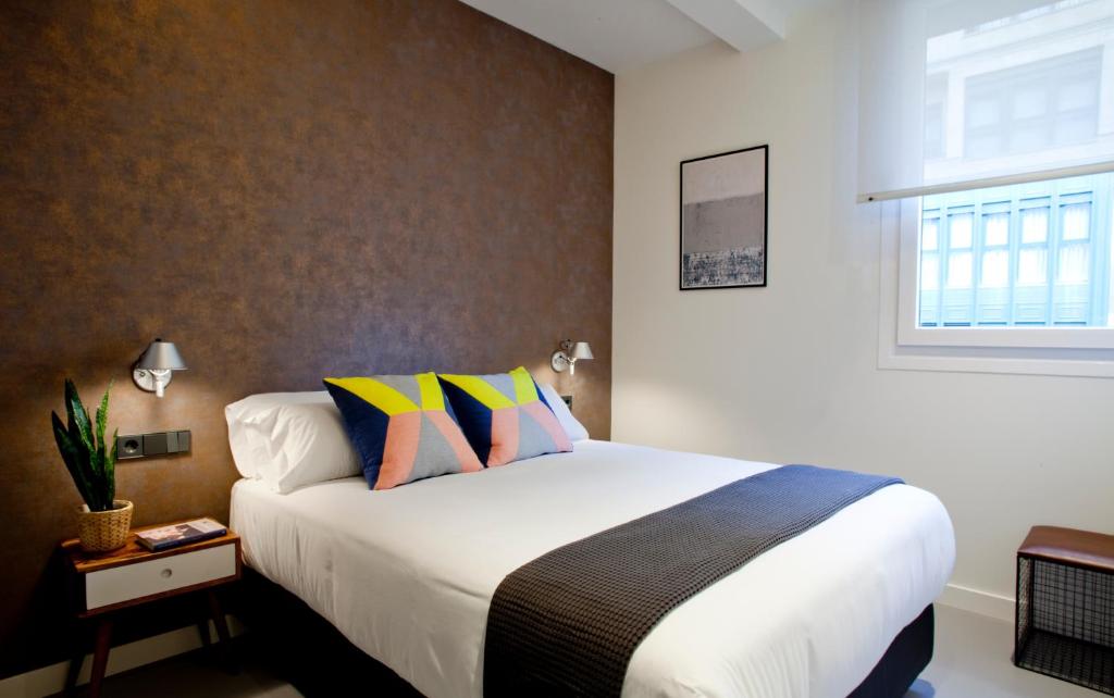 Postel nebo postele na pokoji v ubytování Bilbao Centric Apartments