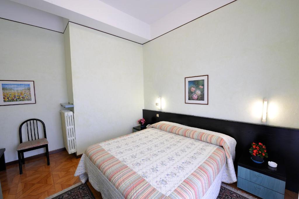 Postel nebo postele na pokoji v ubytování Hotel Villa Mon Toc