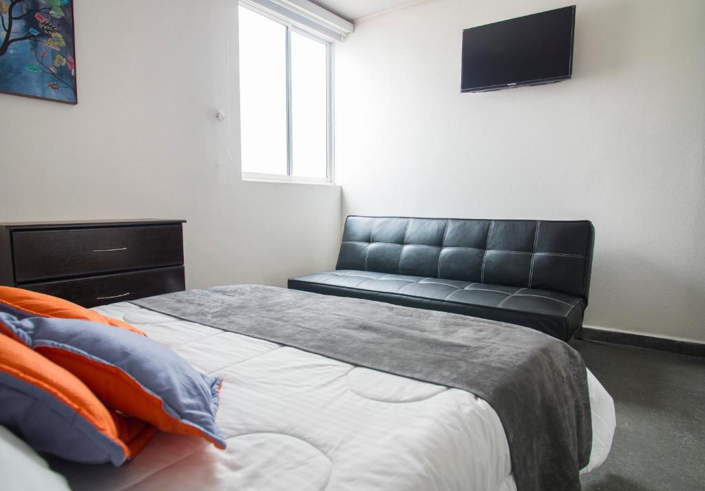 Postel nebo postele na pokoji v ubytování Hotel Grand H&R