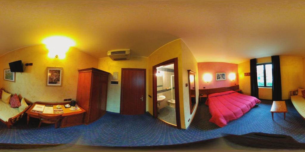 A bed or beds in a room at Hotel Abacus