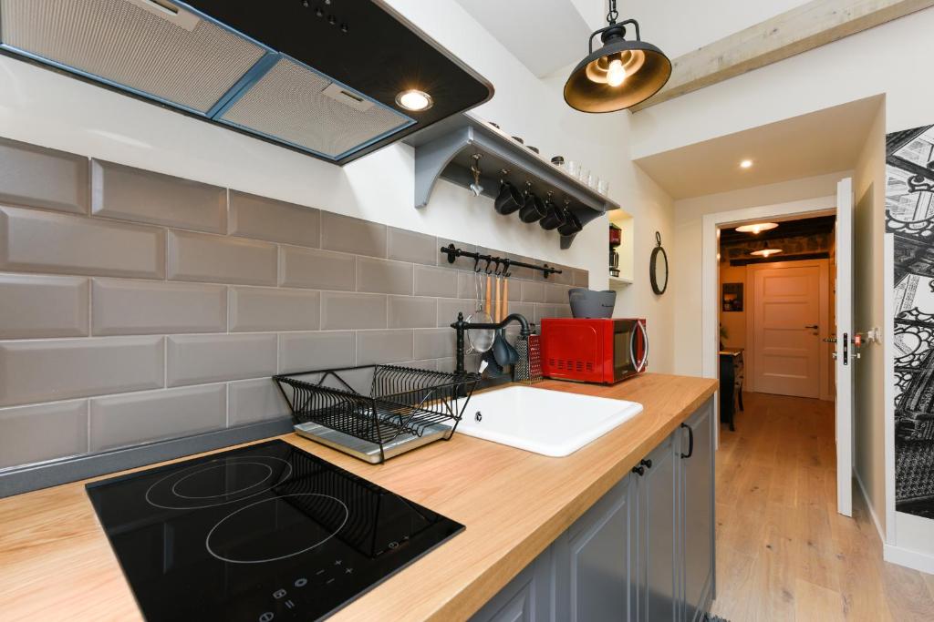 Kuchyňa alebo kuchynka v ubytovaní Apartments Santa Lucia Exclusive