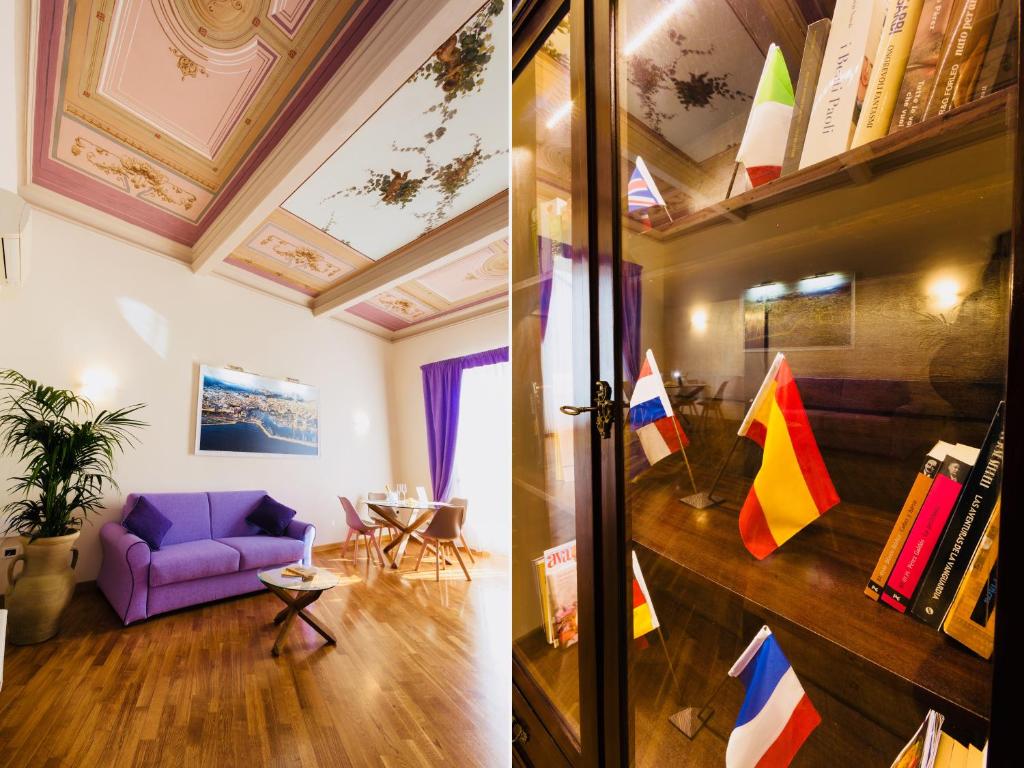 - un salon avec un canapé violet et une table dans l'établissement SUITE 188 - Via Roma, à Palerme