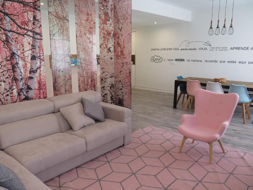 a living room with a couch and a table at Apartamento VI-VI (Vida en Vitoria) in Vitoria-Gasteiz