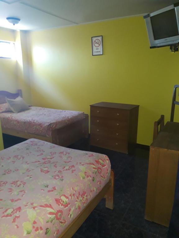 Postel nebo postele na pokoji v ubytování Hotel Aymara