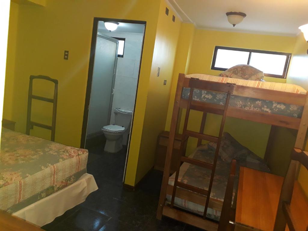 Postel nebo postele na pokoji v ubytování Hotel Aymara