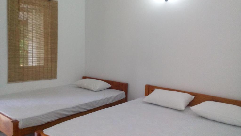 Postel nebo postele na pokoji v ubytování Amadi Rest