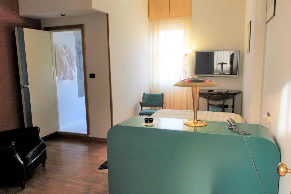 Postel nebo postele na pokoji v ubytování Hotel Napoleon