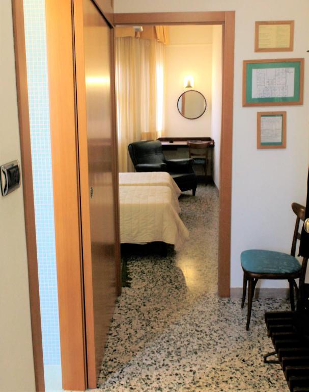 Postel nebo postele na pokoji v ubytování Hotel Napoleon