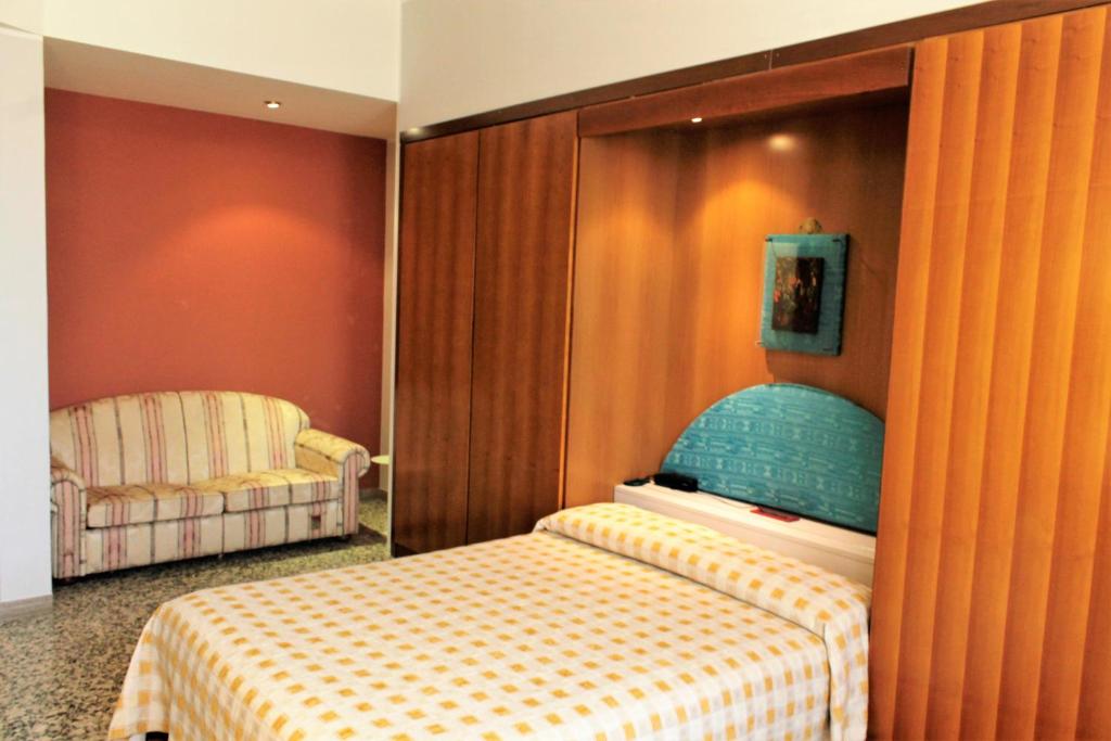 Postel nebo postele na pokoji v ubytování Hotel Napoleon