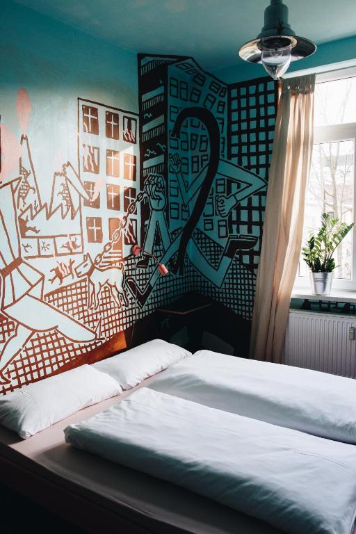 Postel nebo postele na pokoji v ubytování Hostel & Garten Eden