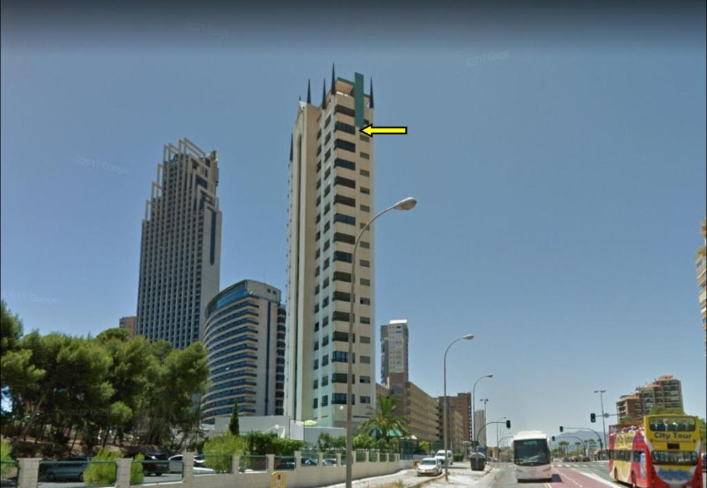 a city with tall buildings and a street light at Coblanca 27 - Playa de Poniente in Benidorm