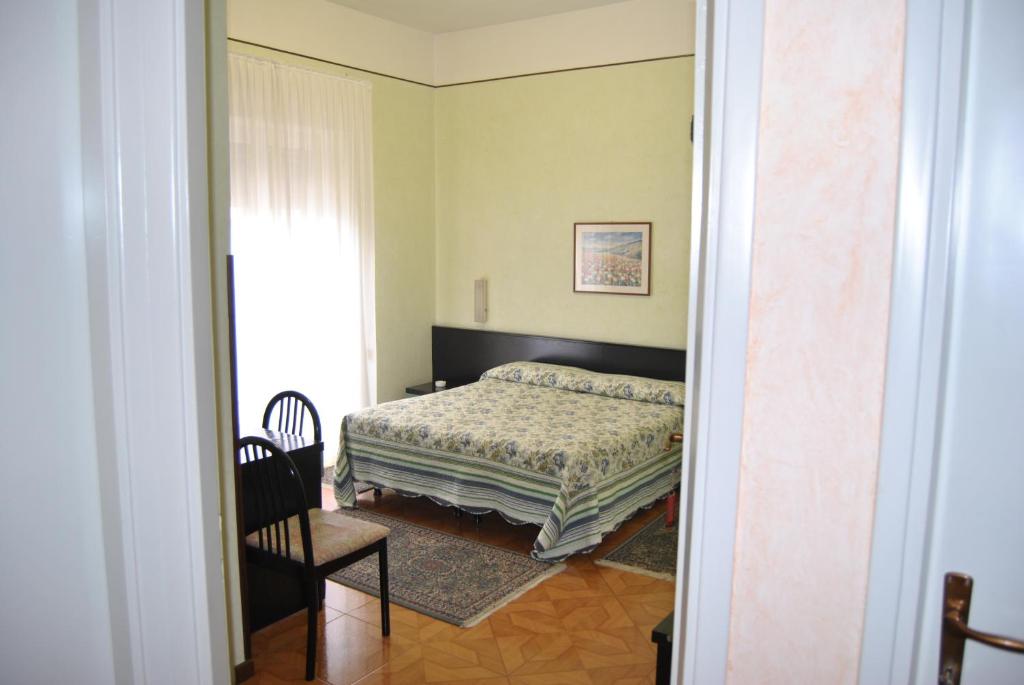 Postel nebo postele na pokoji v ubytování Hotel Villa Mon Toc