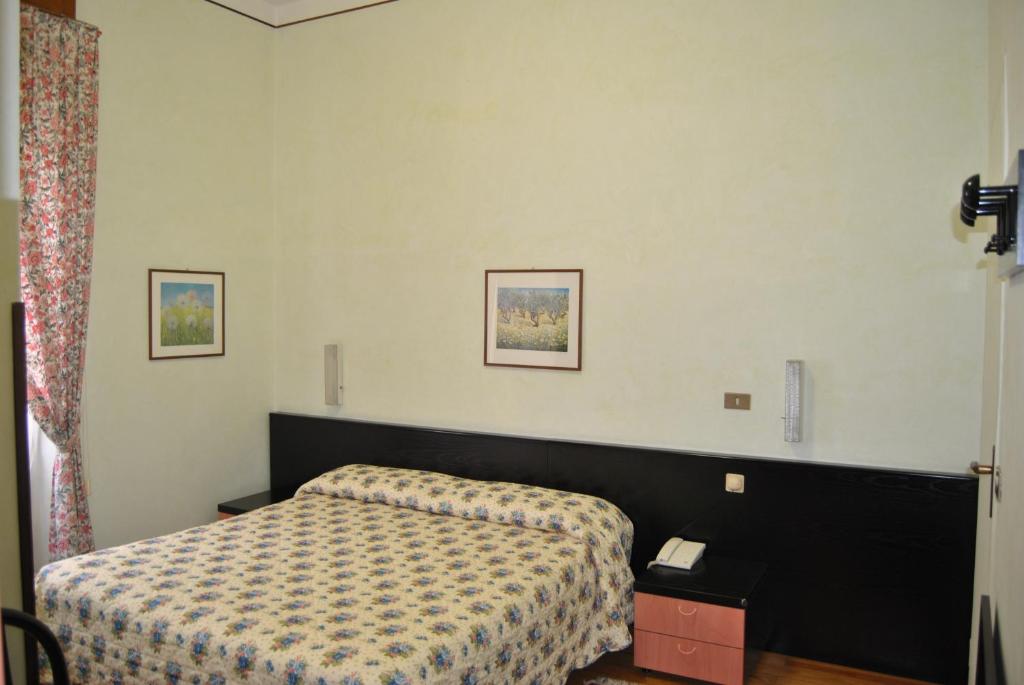 Postel nebo postele na pokoji v ubytování Hotel Villa Mon Toc