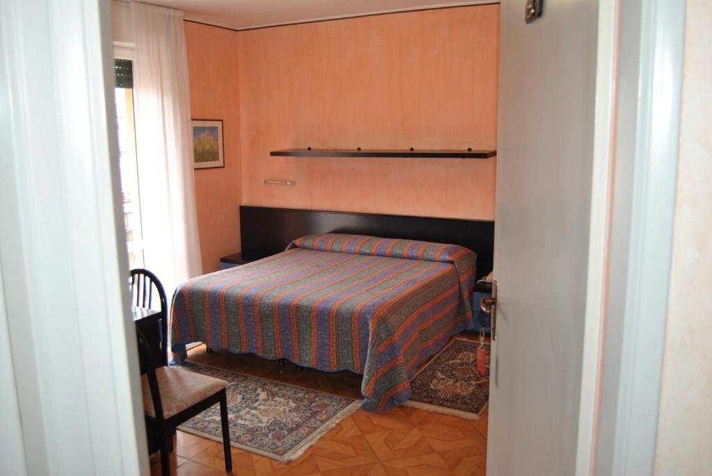 Postel nebo postele na pokoji v ubytování Hotel Villa Mon Toc